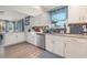 Bright kitchen features white cabinets, modern stainless-steel appliances, and attractive backsplash at 409 36Th Ave. N, North Myrtle Beach, SC 29582