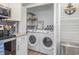 Convenient laundry area with modern washer and dryer units and practical shelving at 409 36Th Ave. N, North Myrtle Beach, SC 29582