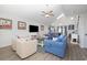 Bright living room with nautical decor, comfortable seating, and seamless access to the open-concept kitchen at 409 36Th Ave. N, North Myrtle Beach, SC 29582