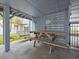 Cozy outdoor dining area with a wooden picnic table and a swing at 409 36Th Ave. N, North Myrtle Beach, SC 29582
