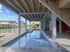 Inviting outdoor pool area with covered space, perfect for relaxing and enjoying waterfront views at 409 36Th Ave. N, North Myrtle Beach, SC 29582