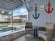 Relaxing poolside seating with comfortable chairs and waterfront views in this outdoor retreat at 409 36Th Ave. N, North Myrtle Beach, SC 29582