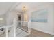 Bright upstairs hallway with modern decor and natural light, connecting the bedrooms at 409 36Th Ave. N, North Myrtle Beach, SC 29582