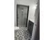 Beautifully renovated bathroom with a modern shower, patterned tile floors, and a stylish vanity at 412 Olive St., Georgetown, SC 29440