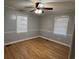Clean bedroom featuring two bright windows, and hardwood floors at 412 Olive St., Georgetown, SC 29440