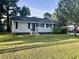 Charming single-story home featuring a well-maintained lawn, complementary shutters, and inviting curb appeal at 412 Olive St., Georgetown, SC 29440