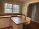 Kitchen area featuring a breakfast bar with seating and wood countertops at 412 Olive St., Georgetown, SC 29440