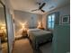 Cozy bedroom featuring a ceiling fan, bedside tables with lamps, and a natural light at 4221 Hibiscus Dr. # 101, Little River, SC 29566