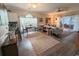 Cozy living room area adjacent to kitchen, with neutral tones, and stylish décor is designed for comfort and gathering at 4221 Hibiscus Dr. # 101, Little River, SC 29566