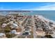 Aerial view of a charming coastal community near the beach with clear blue ocean views at 436 E Third St., Ocean Isle Beach, NC 28469