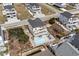 Aerial view of home with a private pool, white fence, and outdoor seating area at 436 E Third St., Ocean Isle Beach, NC 28469