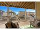 Relaxing outdoor back porch with comfortable seating and a view of surrounding beach houses at 436 E Third St., Ocean Isle Beach, NC 28469