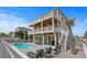 Relaxing backyard with pool, lounge chairs, and a BBQ area at 436 E Third St., Ocean Isle Beach, NC 28469
