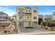 Inviting three-story yellow beach home with dual balconies and stylish coastal design at 436 E Third St., Ocean Isle Beach, NC 28469