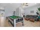 Open game room with pool table, wet bar, and comfortable seating area at 436 E Third St., Ocean Isle Beach, NC 28469