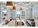 Bright kitchen featuring a central island, stainless steel sink, and ocean views at 436 E Third St., Ocean Isle Beach, NC 28469