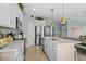 Well-equipped kitchen featuring a large island with seating, stainless appliances, and ample countertop space for cooking at 436 E Third St., Ocean Isle Beach, NC 28469