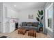 Cozy living room area featuring a wet bar, comfortable seating and beachy accents at 436 E Third St., Ocean Isle Beach, NC 28469