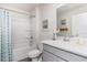 Clean bathroom with a shower, modern vanity, and bright natural lighting at 4517 East Coast Ln., Shallotte, NC 28470