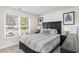 Bright bedroom with large window, a comfortable bed, and stylish decor at 4517 East Coast Ln., Shallotte, NC 28470