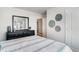 Bedroom featuring a bed, dresser with mirror, and stylish wall decorations at 4517 East Coast Ln., Shallotte, NC 28470