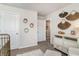 Bright Bedroom with a white dresser and modern hexagon and straw wall art at 4517 East Coast Ln., Shallotte, NC 28470