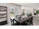 Cozy dining area with a view of the backyard through sliding glass doors, connecting to the inviting living room at 4517 East Coast Ln., Shallotte, NC 28470