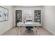 Functional home office space with a modern desk, shelving, and bright natural light at 4517 East Coast Ln., Shallotte, NC 28470