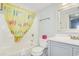 Charming bathroom featuring a flip-flop themed shower curtain and modern vanity at 4601 N Ocean Blvd. # 201, North Myrtle Beach, SC 29582