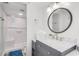 Bathroom with white walls, modern vanity with marble countertop, and walk-in shower at 4601 N Ocean Blvd. # 201, North Myrtle Beach, SC 29582