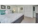 Comfortable bedroom with a queen bed, coastal decor, and large closet at 4601 N Ocean Blvd. # 201, North Myrtle Beach, SC 29582