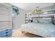 Cozy bedroom featuring a bunk bed, storage shelves, carpet floor, and coastal themed decor for a relaxing atmosphere at 4601 N Ocean Blvd. # 201, North Myrtle Beach, SC 29582