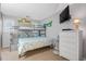 Bedroom featuring bunk beds, playful decor, and a mounted TV at 4601 N Ocean Blvd. # 201, North Myrtle Beach, SC 29582