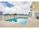 Community pool with clear blue water, surrounded by lounge chairs for relaxing poolside at 4601 N Ocean Blvd. # 201, North Myrtle Beach, SC 29582