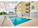 Community pool with clear blue water, surrounded by lounge chairs for relaxing poolside at 4601 N Ocean Blvd. # 201, North Myrtle Beach, SC 29582