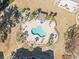 Aerial view of the community pool with palm trees and a lounge area at 4787 Wild Iris Dr. # 203, Myrtle Beach, SC 29577