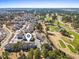 An aerial view of the community featuring a golf course, lake, and mature trees at 4787 Wild Iris Dr. # 203, Myrtle Beach, SC 29577