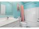Aqua bathroom complete with a sink, toilet, shower, and tub, designed for relaxation at 4787 Wild Iris Dr. # 203, Myrtle Beach, SC 29577