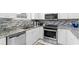 Well-equipped kitchen with stainless steel appliances and updated countertops at 4787 Wild Iris Dr. # 203, Myrtle Beach, SC 29577