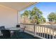 Enjoy this outdoor patio area overlooking beautiful mature trees and luscious landscaped grounds at 4787 Wild Iris Dr. # 203, Myrtle Beach, SC 29577