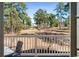 Enjoy the view from this outdoor patio featuring beautiful landscaping and mature trees in a serene setting at 4787 Wild Iris Dr. # 203, Myrtle Beach, SC 29577