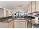 Bright kitchen featuring granite countertops, stainless steel appliances, and open layout at 4800 S Ocean Blvd. # 304, North Myrtle Beach, SC 29582