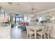 Open-concept living and dining area with stylish decor, balcony access, and ocean views at 4800 S Ocean Blvd. # 304, North Myrtle Beach, SC 29582