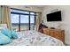 Comfortable bedroom with ocean views, balcony access, and a relaxing ambiance at 4800 S Ocean Blvd. # 304, North Myrtle Beach, SC 29582