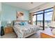 Inviting bedroom with balcony access showcasing ocean views and beach-themed decor at 4800 S Ocean Blvd. # 304, North Myrtle Beach, SC 29582