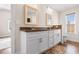 Bathroom featuring a dual vanity with granite countertops, white cabinets, and brushed gold hardware at 5026 Adrian Hwy., Conway, SC 29526