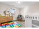 Well-lit Bedroom with soft, neutral walls, wood-look floors, and a comfortable chair at 5026 Adrian Hwy., Conway, SC 29526