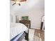 Cozy bedroom with light-filled window, wood flooring, and a ceiling fan at 5026 Adrian Hwy., Conway, SC 29526