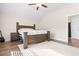 Bedroom with vaulted ceilings, wood flooring, a ceiling fan, and a classic wood furniture set at 5026 Adrian Hwy., Conway, SC 29526