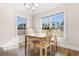Sunlit dining room featuring a wooden table with four chairs and large windows offering exterior views at 5026 Adrian Hwy., Conway, SC 29526